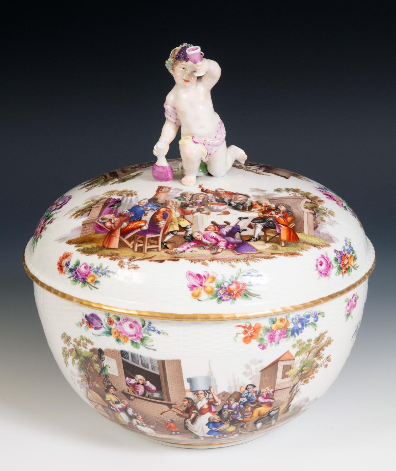 A Berlin porcelain punch bowl and cover, with a putto finial, decorated extensive scenes of