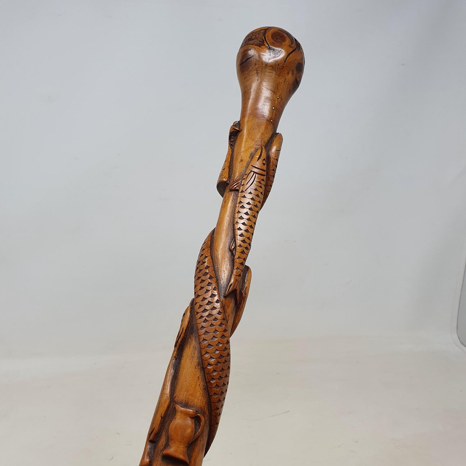 A 19th century one piece folk art walking stick, staff carved with animals, implements, and sporting - Image 5 of 6