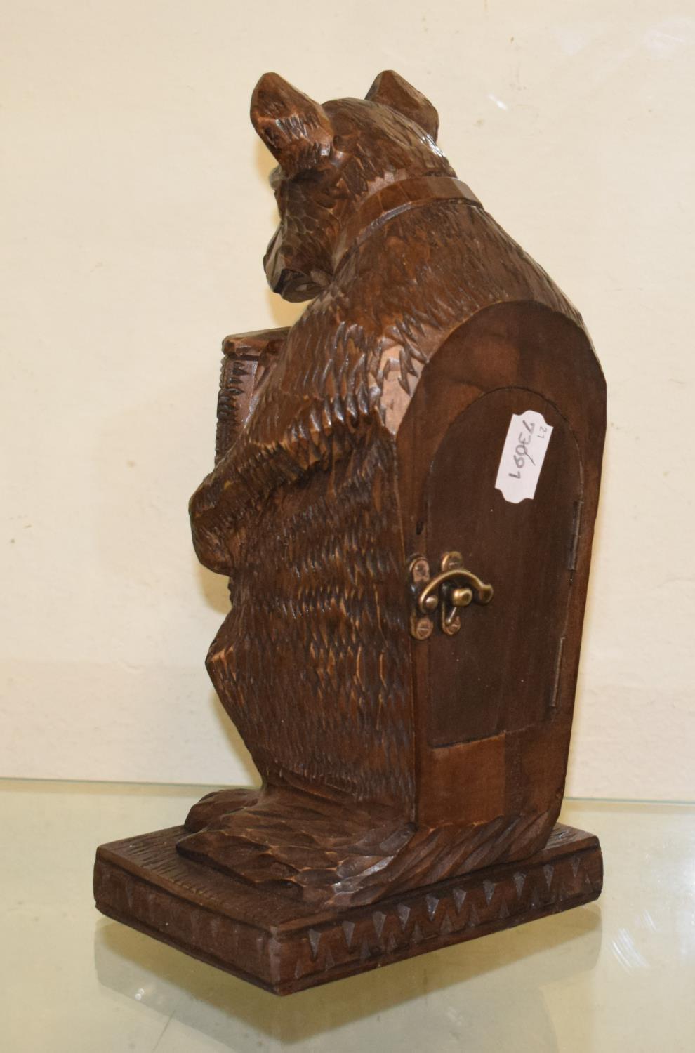 A timepiece, with Arabic numerals, in a Black Forest style carved wood bear case, 30 cm high - Image 2 of 5