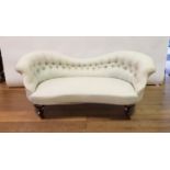 A 19th century button back sofa on carved cabriole legs, 180 cm wide