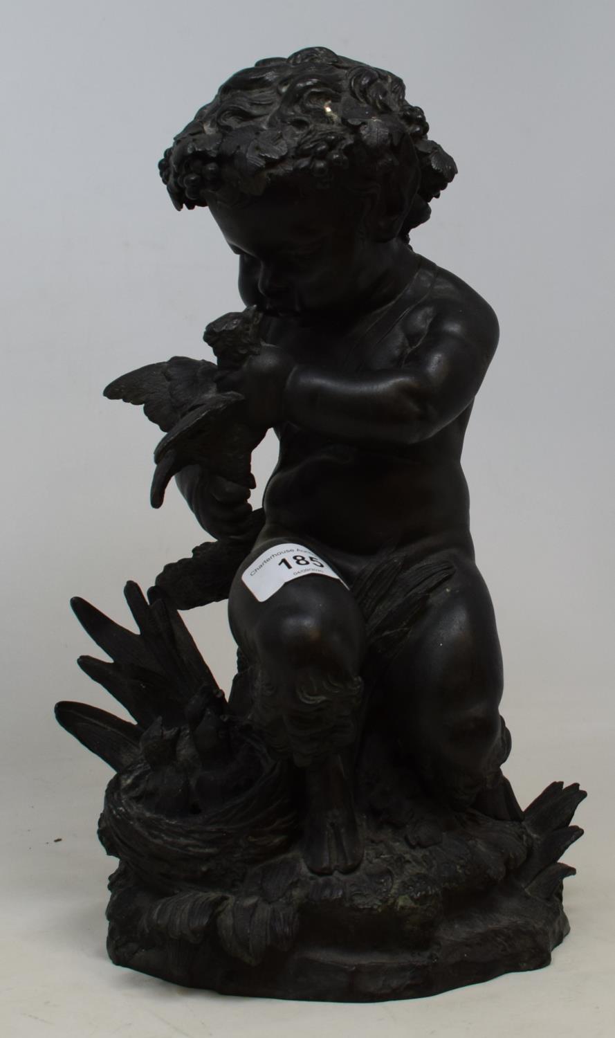 A 19th century bronze group, of a faun killing a bird, 34 cm high