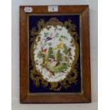 A 19th century Sevres style porcelain plaque, central cartouche, decorated with landscape and exotic