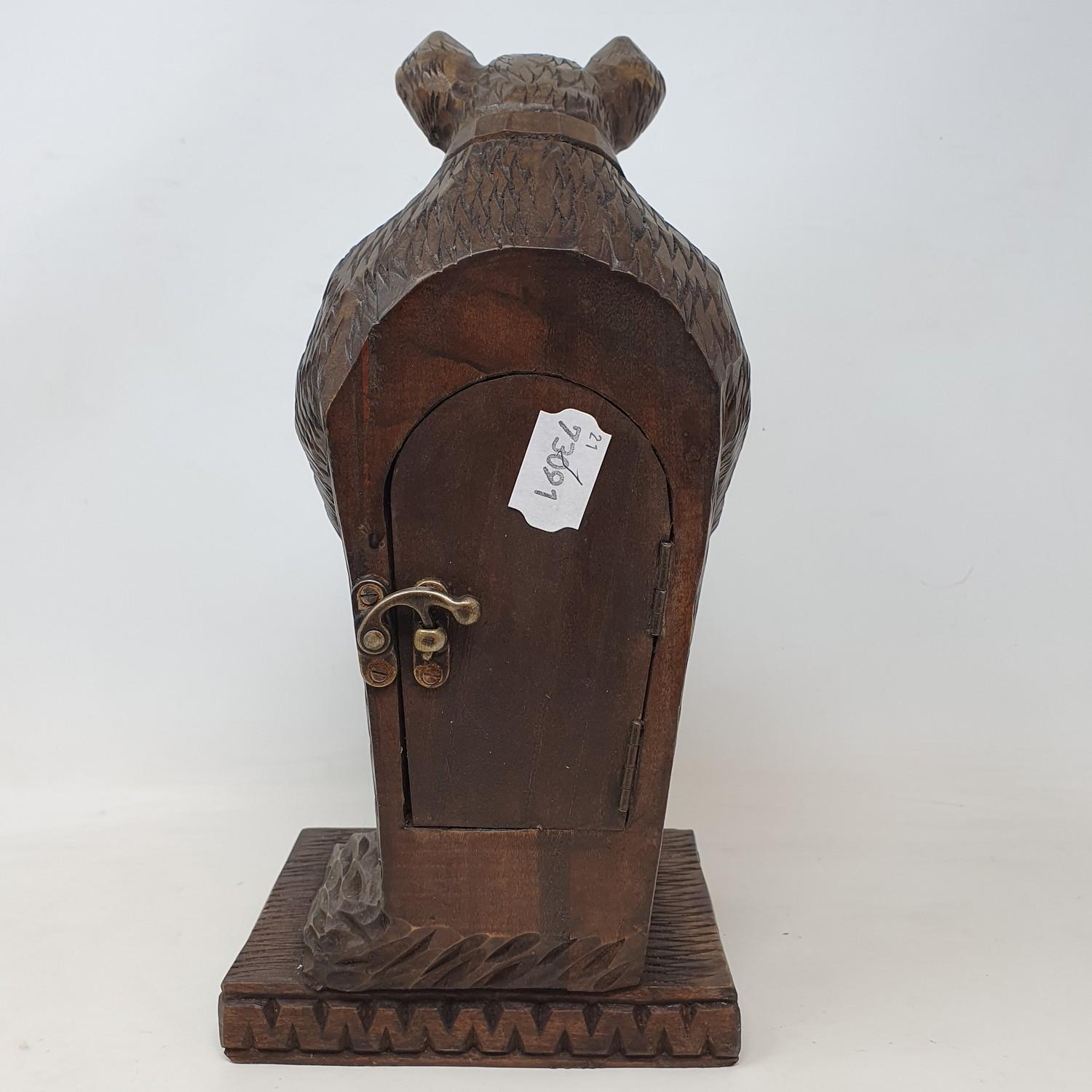 A timepiece, with Arabic numerals, in a Black Forest style carved wood bear case, 30 cm high - Image 4 of 5