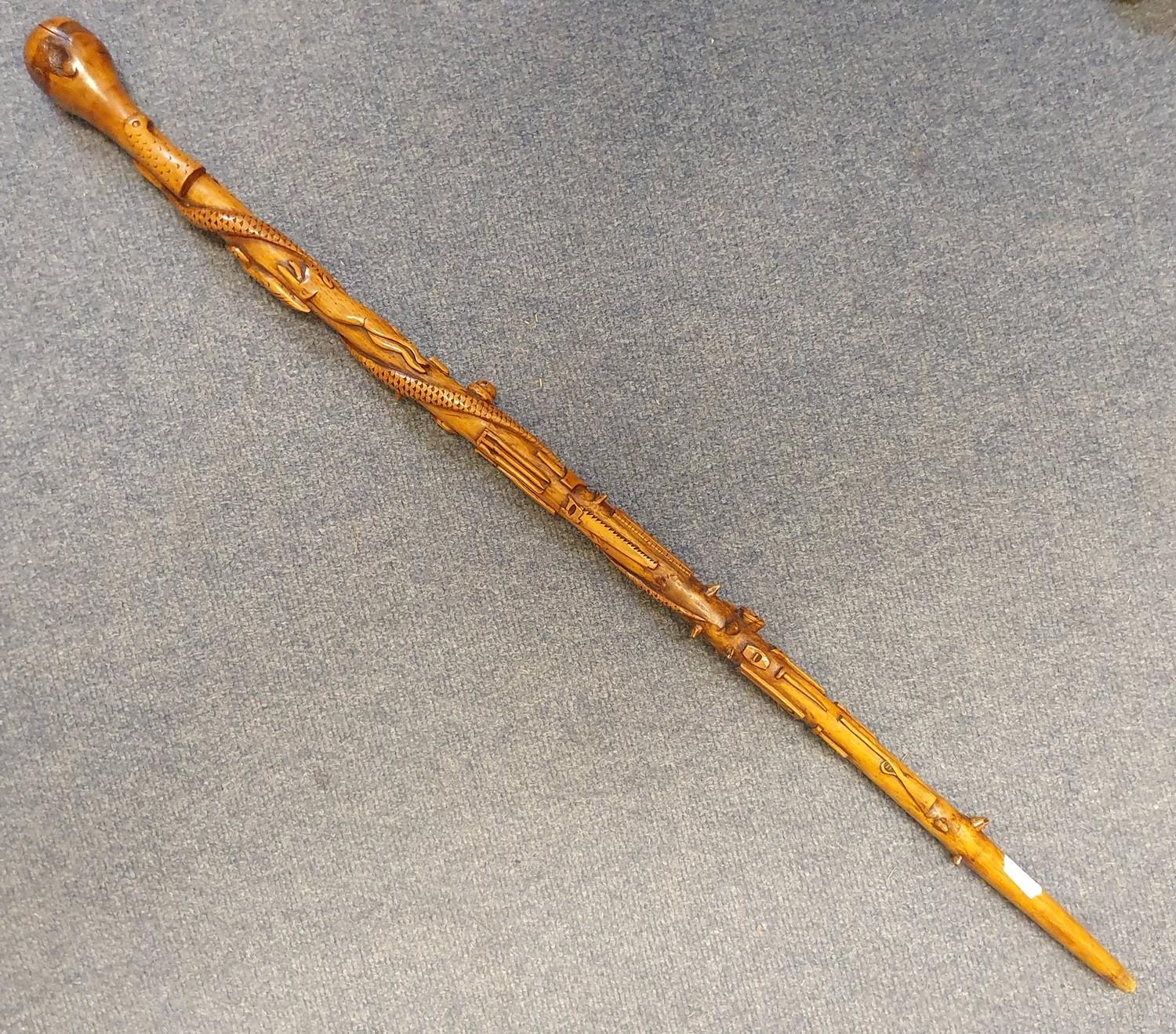 A 19th century one piece folk art walking stick, staff carved with animals, implements, and sporting - Image 6 of 6