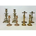 Four pairs of brass candlesticks, tallest 23 cm high