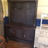 An oak dresser, base having to cupboard doors, 136 cm wide