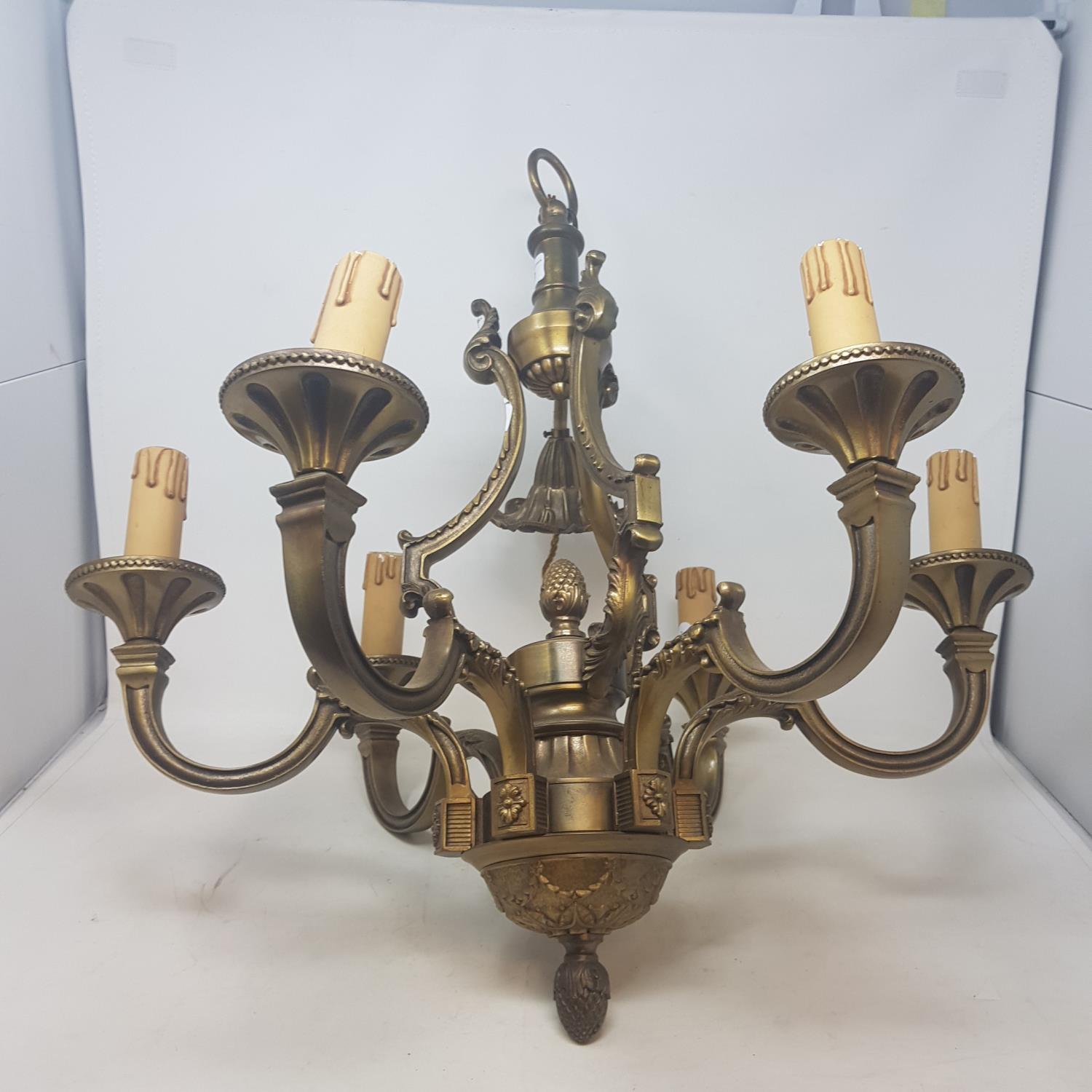 A brass six branch chandelier, 50 cm diameter