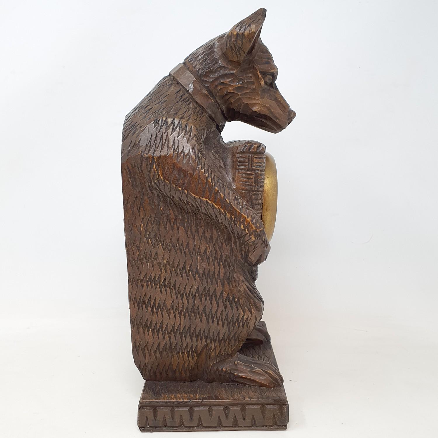 A timepiece, with Arabic numerals, in a Black Forest style carved wood bear case, 30 cm high - Image 5 of 5