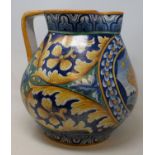 A early 20th century majolica jug, central cartouche painted with lion, 30 cm high