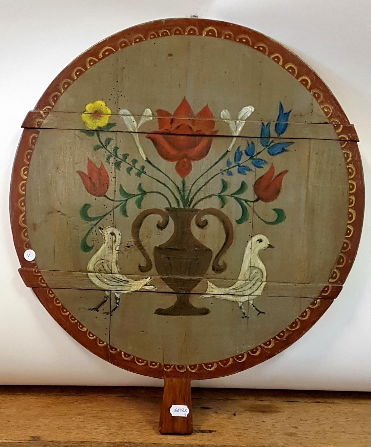 A 19th century painted barrel top, decorated with flowers and doves, 59 cm diameter