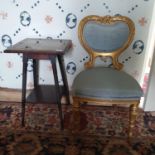 An Arts & Crafts style two tier mahogany table, with a tile inset top, 41 cm wide, and a gilt chair