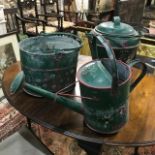 A bargeware type painted watering can, and two other similar items (3)
