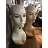 Two mannequin heads, 48 cm high