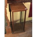 A small glazed oak cabinet, 32.5 cm square by 64 cm high, and an oak carver chair (2)