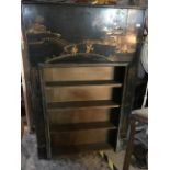 A 1920s black lacquered fire surround, with Chinnoiserie style decoration, made in to a bookcase,