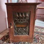 An Art Nouveau small oak cupboard, 34 cm wide, adapted, an oval wall mirror, three model aeroplanes,