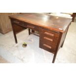 An oak office desk, 121 cm wide