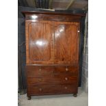 A 19th century mahogany linen press, the top section adapted for hanging, above drawers, 144 cm wide