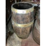 A coopered oak barrel stand, 51 cm high, and a similar barrel