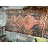 A Kazak style rug, worn, 183 x 112 cm