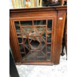 A 19th century inlaid mahogany hanging corner cupboard, 102 cm wide, and a similar oak cabinet, 93