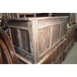 An 18th century carved oak coffer, 124 cm wide