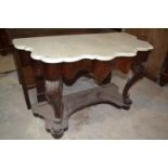 A Victorian mahogany washstand, with a marble top, 120 cm wide, lacks gallery back