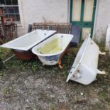 A cast iron bath, three other baths and a sink