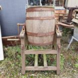 A butter churn on stand, two fire surrounds, and oak barrel, and two cast metal stands (6)