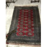 A Turkoman style rug, 195 x 127 cm
