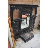 A late 19th century Anglo-Flemish carved oak hat stand, with a mirror, 111 cm wide