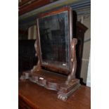 A Victorian mahogany dressing mirror, 61 cm wide, a low x frame chair, and a painted shelf, 140 cm