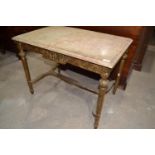 A French style gilt table, with a marble top, 85 cm wide x 64 cm high