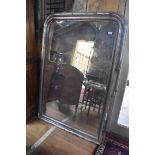 An overmantle mirror, with distressed silver decoration, 104 cm wide x 151 cm high