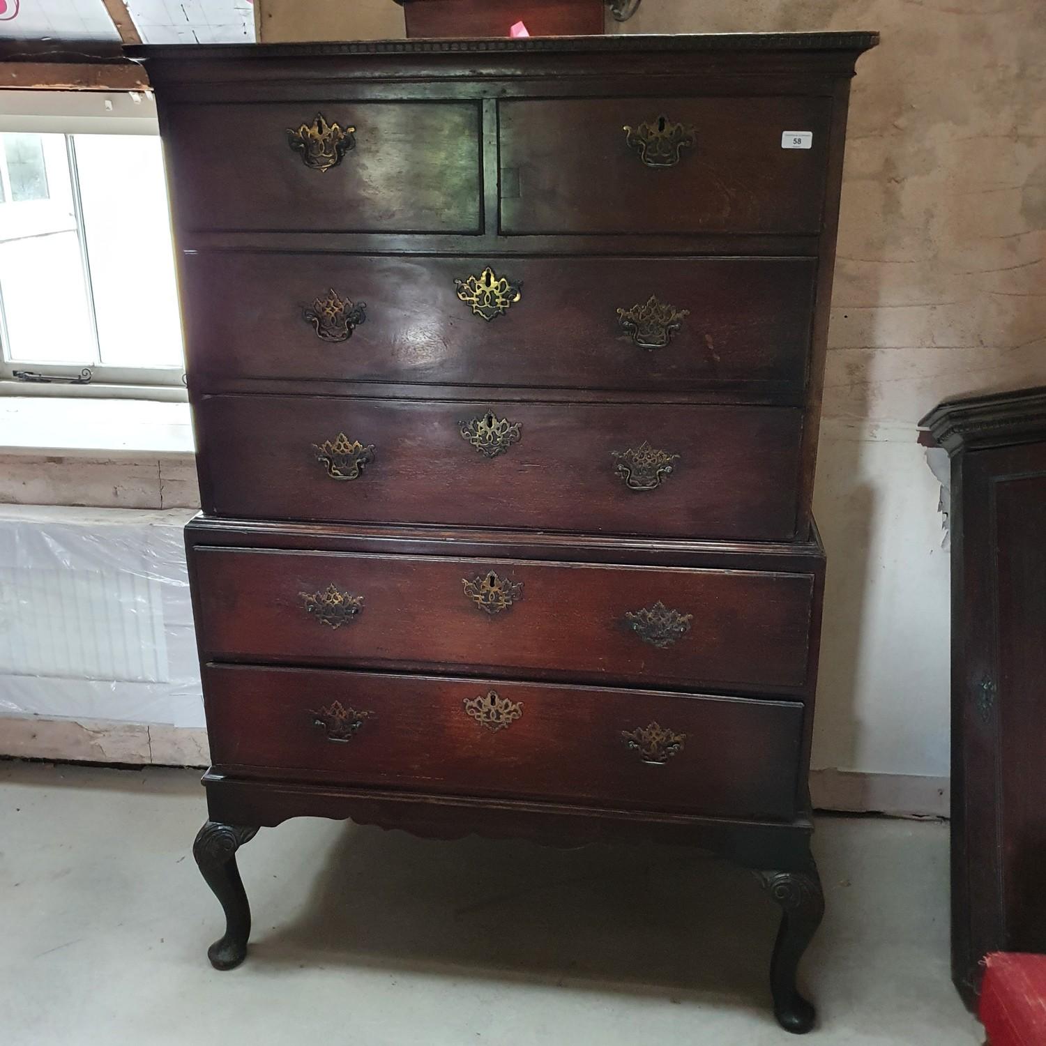 A mahogany chest on chest, on carved cabriole legs, and pad feet, 102 cm wide x 157 cm high