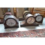 Five oak mantle clocks, two firescreens, and a carved box stool, 49 cm wide (8)