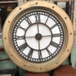 A metal clock face, 81 cm diameter, in a frame, 114 cm diameter