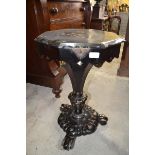 A Victorian papier mache octagonal work table, with gilt and mother of pearl decoration, 47 cm wide