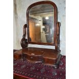 A Victorian mahogany dressing mirror, with three drawers, 60 cm wide, and a small rug