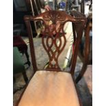 A set of four George III style dining chairs