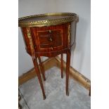 A French oval inlaid bedside chest, with brass mounts, 40 cm wide x 73.5 cm high