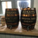 A pair of Morans sherry oak half barrels, 34 cm high