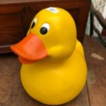 A composition duck, 34 cm high, three orange and yellow enamel light shades, 24 cm high, and a