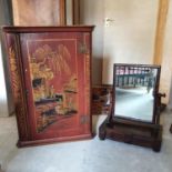 A hanging corner cupboard, with red chinoiserie decoration, 58 cm wide, and a Victorian mahogany
