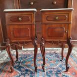 A pair of French walnut bedside cupboards, with marble tops, 38 cm wide x 84 cm high