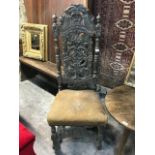 A 17th century style carved oak single chair