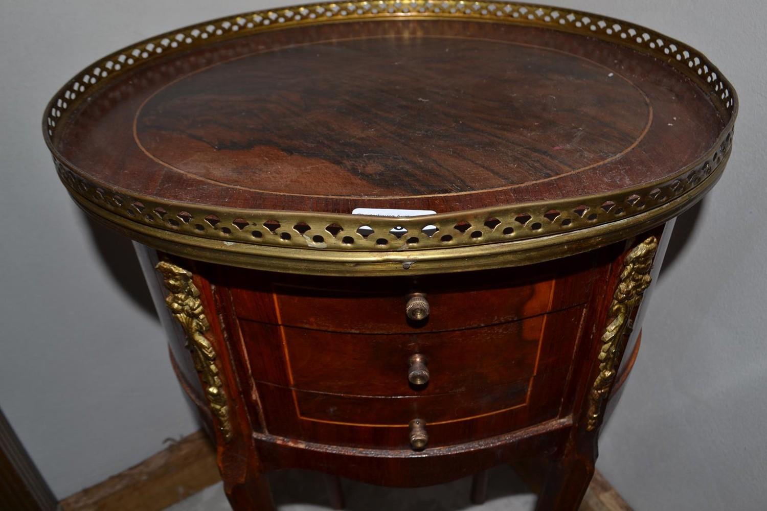 A French oval inlaid bedside chest, with brass mounts, 40 cm wide x 73.5 cm high - Image 2 of 3