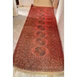 A Chinese rug, worn, 187 x 103 cm, and three other rugs (4)