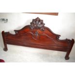 A Victorian style mahogany footboard, from a half tester bed, 210 cm wide