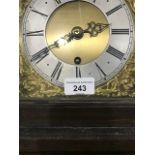 A longcase clock, the 17.5 cm square brass dial with a silvered chapter ring in an oak case, with